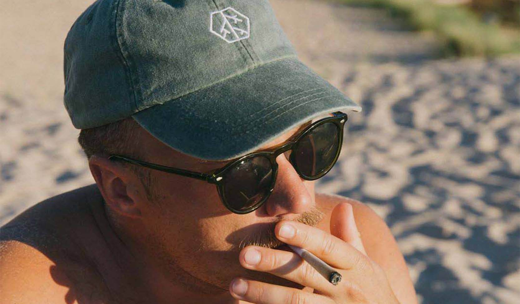 Man Wearing Quality Roots Dispensary Hat