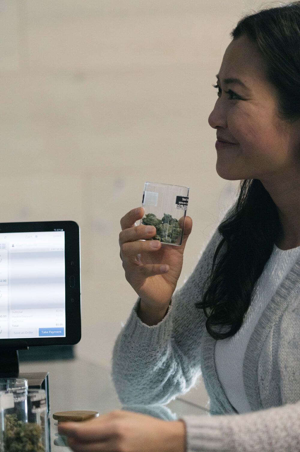 Woman smelling cannabis